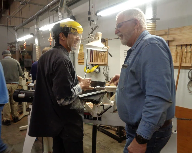 SEEDs instructor working one-on-one with a participant on jewelry metalwork