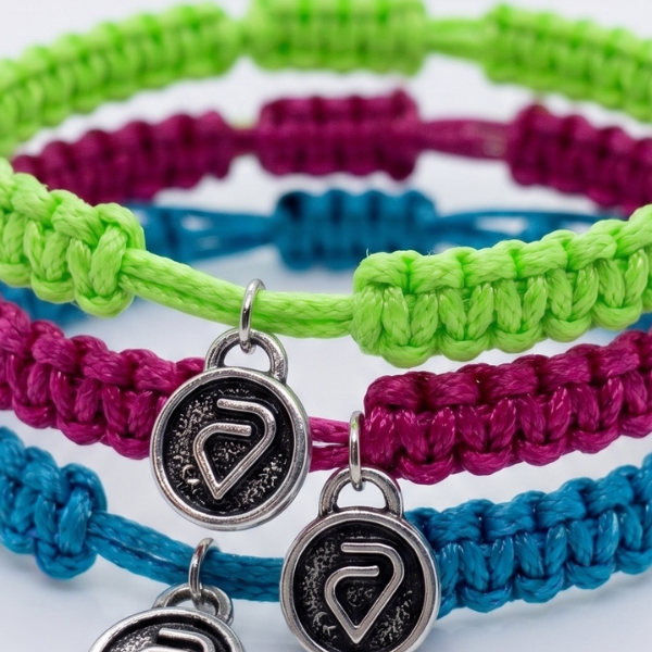 Custom green, magenta, and teal Valleywise Health Caring Cords for rebrand and campaign launch